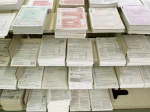 Piles of tax forms are seen at the 58th Street Lib 