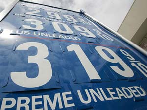  A sign displays gas prices at over $3 per gallon 