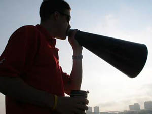 Padgett, armed with coffee, shouts advice in the m 