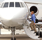 A man boards a private jet 