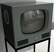 Onlooker watches TV at an electronics store. 