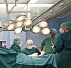 Doctors perform surgery. 