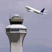 A plane flies past the control tower at Salt ... 