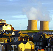 Steam rises from the cooling towers at ... 