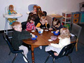 These children are doing a craft project in the ho