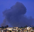 Smoke billows from Burj al-Shemali, three kms ... 