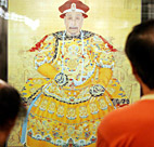 Propective buyers admire a painting of a ... 