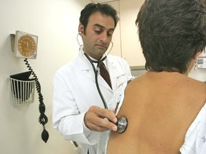 A doctor examines a patient at the University of California's Women's Health Center June 21 in San Francisco, Calif.