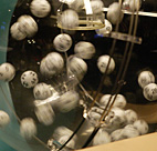 Lottery balls fly in the hopper 