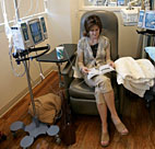 A cancer patient reads a book while receiving ... 