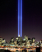 Beams of light shine into the sky behind the ... 