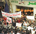 Egyptians hold up banners during a protest in ... 
