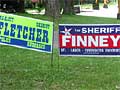 Dueling lawn signs