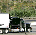 A truck rolls down the highway 