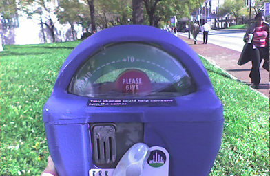
                    Along the sidewalks on Pratt street between Harborplace and Oriole Park, nine meters have been set up to raise money for Homeless Services Inc. of Baltimore, Maryland. The meter's default setting of "despair" rises to "hope" when coins are inserted. You can insert nickels, dimes, and quarters. You get the same amount of "hope" regardless of the denomination inserted.
                                            (Melody Simmons)
                                        