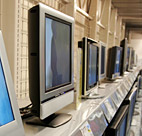 A customer at a Best Buy store looks at a ... 
