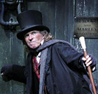 Actor Tommy Steele as Scrooge in a 2005 stage ... 
