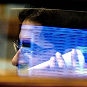 A Wall Street stockbroker monitors the Dow 