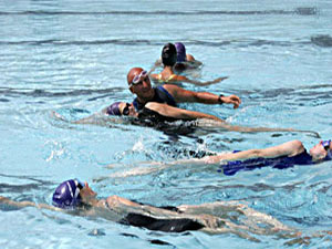 Swimming Instructor Steven Shaw with pupils. 