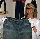 Levi's Corporate Archivist Lynn Downey holds ... 