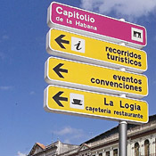 Signs point the way for tourists in Havana, Cuba. 