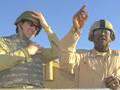 Gov. Tim Pawlenty with Emmanuel Kintu