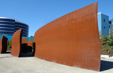 
                    "Wake," 2004. 10 plates, 5 sets of locked toroid forms, weatherproof steel. Richard Serra. Purchased in part with funds from Susan and Jeffrey Brotman, Virginia and Bagley Wright, Ann Wyckoff and the Modern Art Acquisition Fund, in honor of the 75th Anniversary of the Seattle Art Museum, 2004.94 © Richard Serra.
                                            (Paul Macapia)
                                        