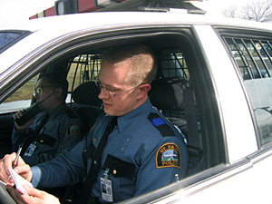 Recruit Charlie Anderson practices writing a ticket.