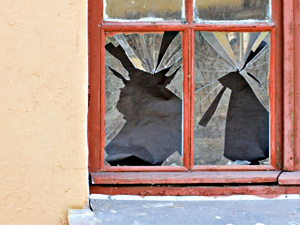 Window broken by house burglary 