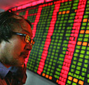 A Chinese investor watches prices on the ... 