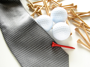A tie and golf balls 