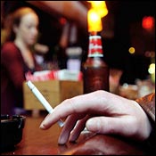 Lighting up at a NYC bar before smoking ban 