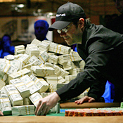 Last year's winner Jamie Gold  makes a bet in ... 