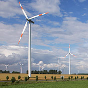 Wind turbines spin near Bornstedt, Germany. ... 