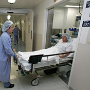 A hospital patient is wheeled into the ... 