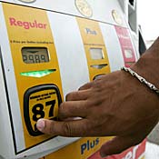 A gas customer selects regular grade 