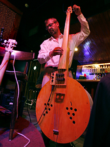Washtub bass player Jon Olson tunes up before the Roe Family Singers perform at the 331 Bar in northeast Minneapolis. Washtub bass player Jon Olson tunes up before the Roe Family Singers perform at the 331 Bar in northeast Minneapolis.
