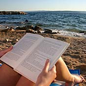 Beachgoer reads a book 