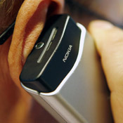 A man talks on his Nokia cell phone. 