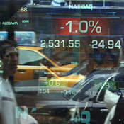 A ticker shows the NASDAQ down 1 percent ... 