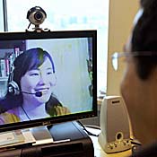 Skype users on a video call using webcams 