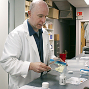 Pharmacist Howard Brooker fills a prescription ... 
