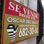 A sale sign hangs outside a residence in ... 