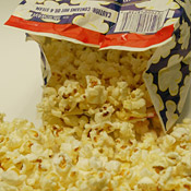 A freshly-popped bag of microwave popcorn 