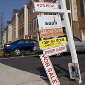 Competing For Sale and For Rent signs 