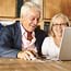 A senior couple on a laptop