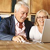 A senior couple on a laptop 