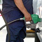 Customer pumps gas into a car. 