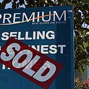 A sold sticker on a house 