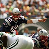New England Patriots' Tom Brady signals defense 